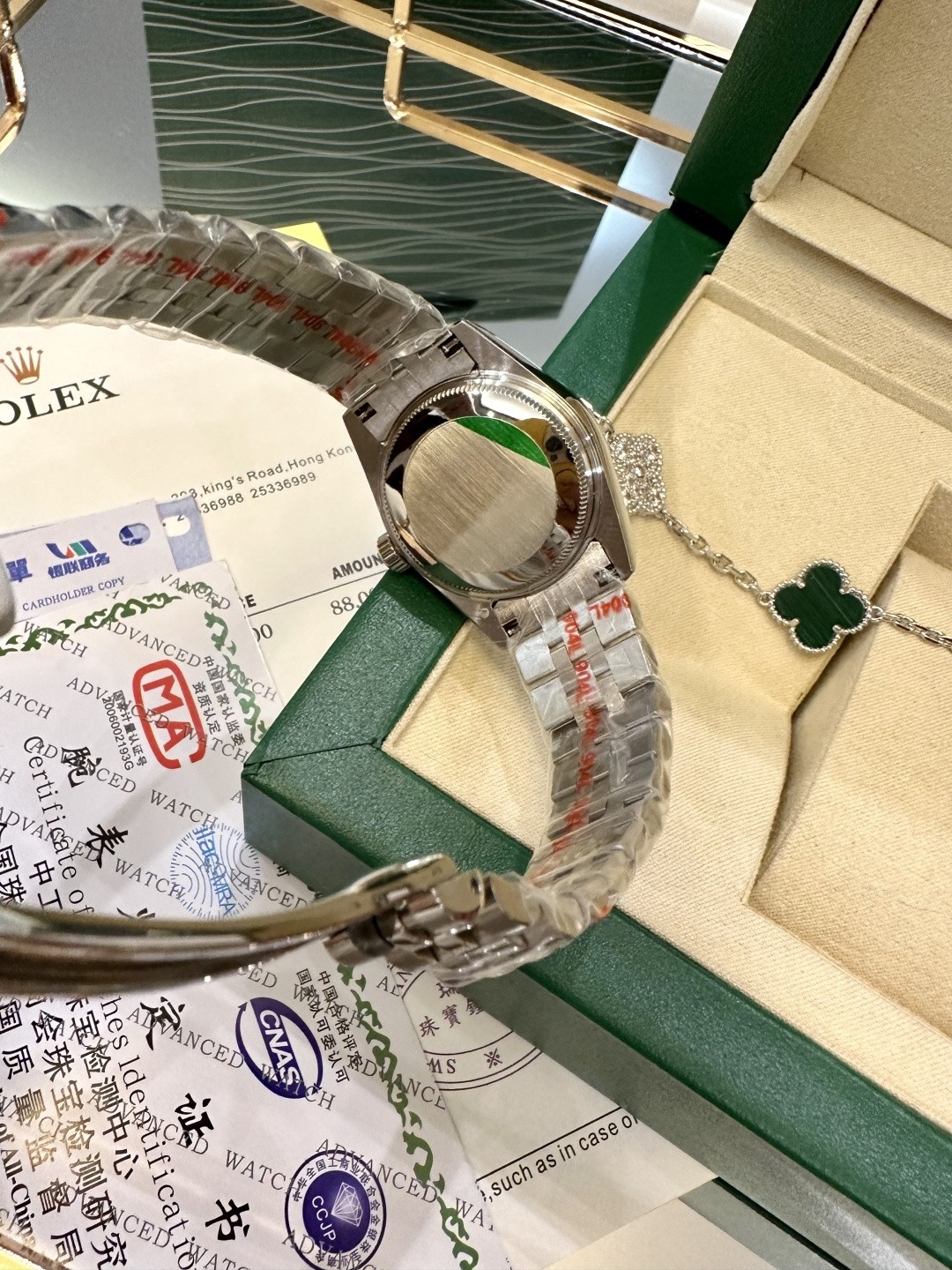 The Rolex watch is a Datejust model.