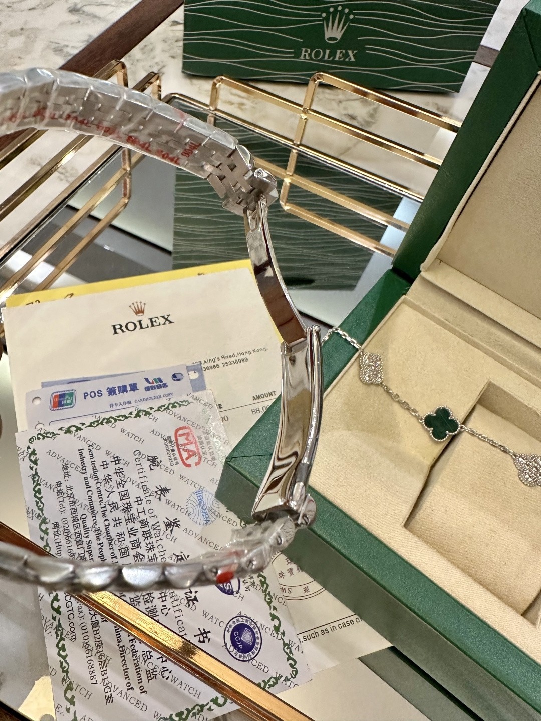 The Rolex watch is a Datejust model.