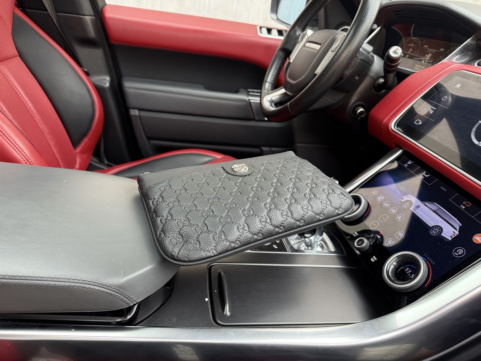 Gucci GG Embossed Leather Clutch