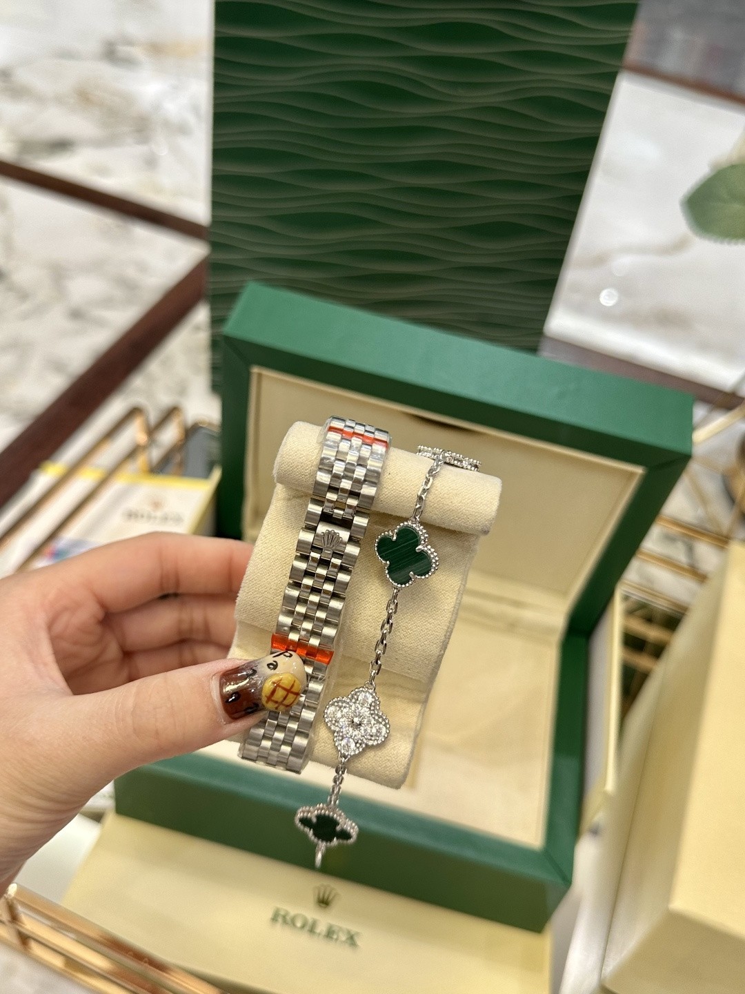 The Rolex watch is a Datejust model.