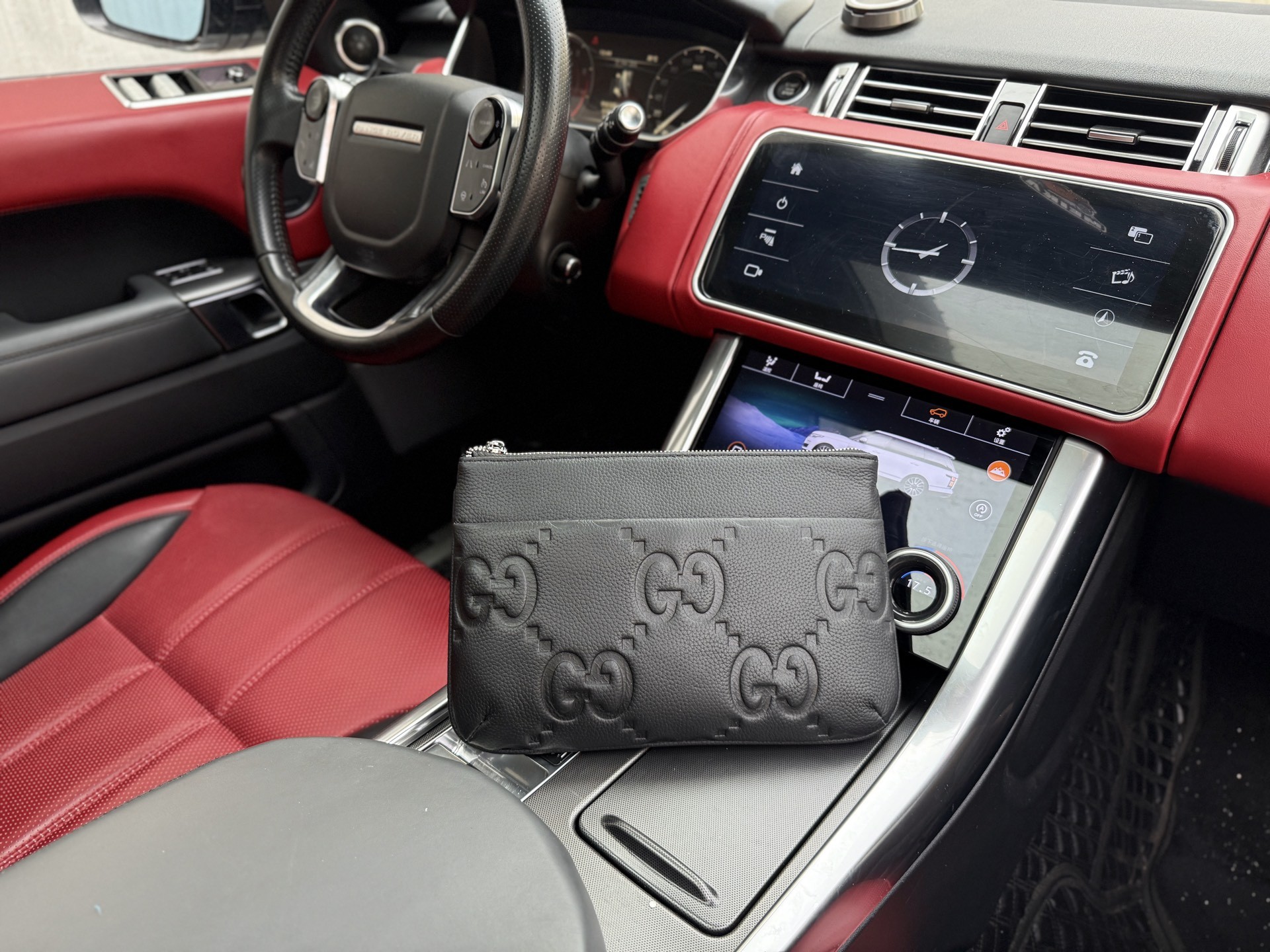 Gucci GG Embossed Leather Clutch